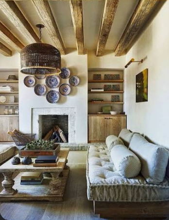 VitaStyle interior design living room with wooden beams and custom furniture